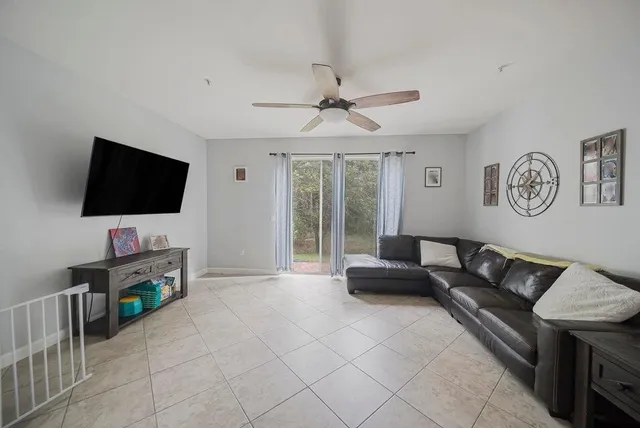 a living room with furniture and a window