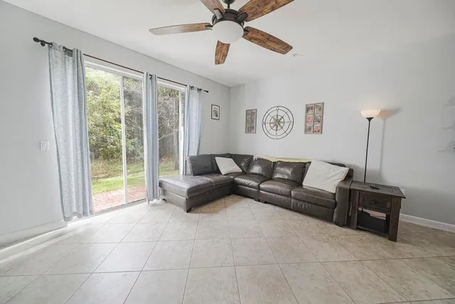 a view of a hallway with paintings on the wall