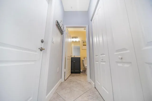 a view of a room with wooden floor