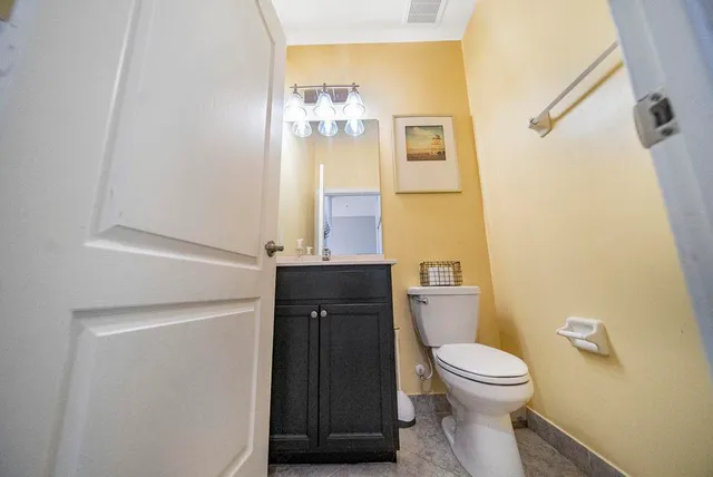 a bedroom with a bed and a table in it