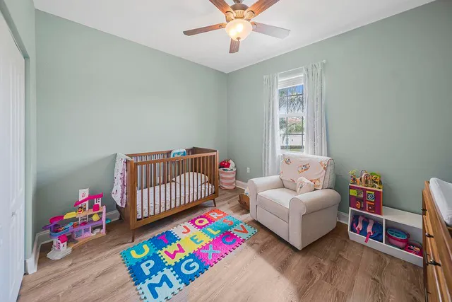 a bedroom with furniture and a window