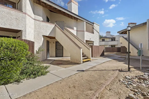 a view of a swimming pool with a bench in workspace