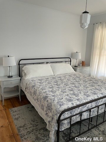 412 Greenport, undefined 00000 - Photo 11 of 18 a bedroom with a bed and dresser