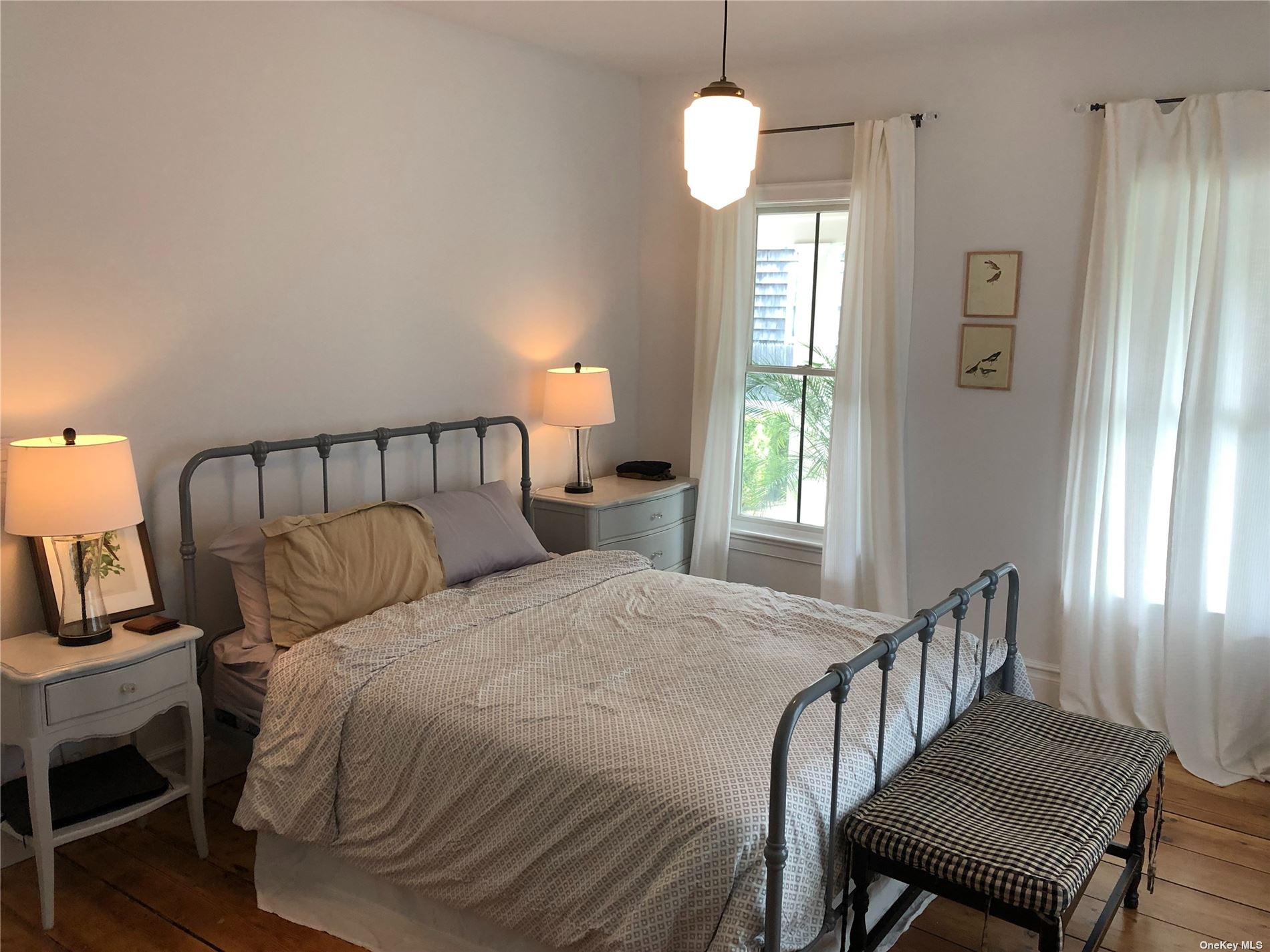 412 Greenport, undefined 00000 - Photo 13 of 18 a bedroom with bed and a window