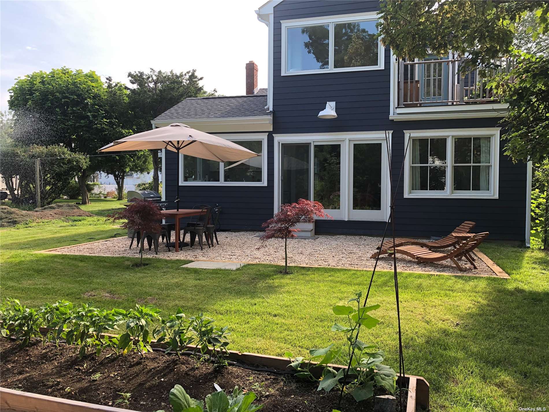 412 Greenport, undefined 00000 - Photo 2 of 18 a view of a house with backyard porch and sitting area