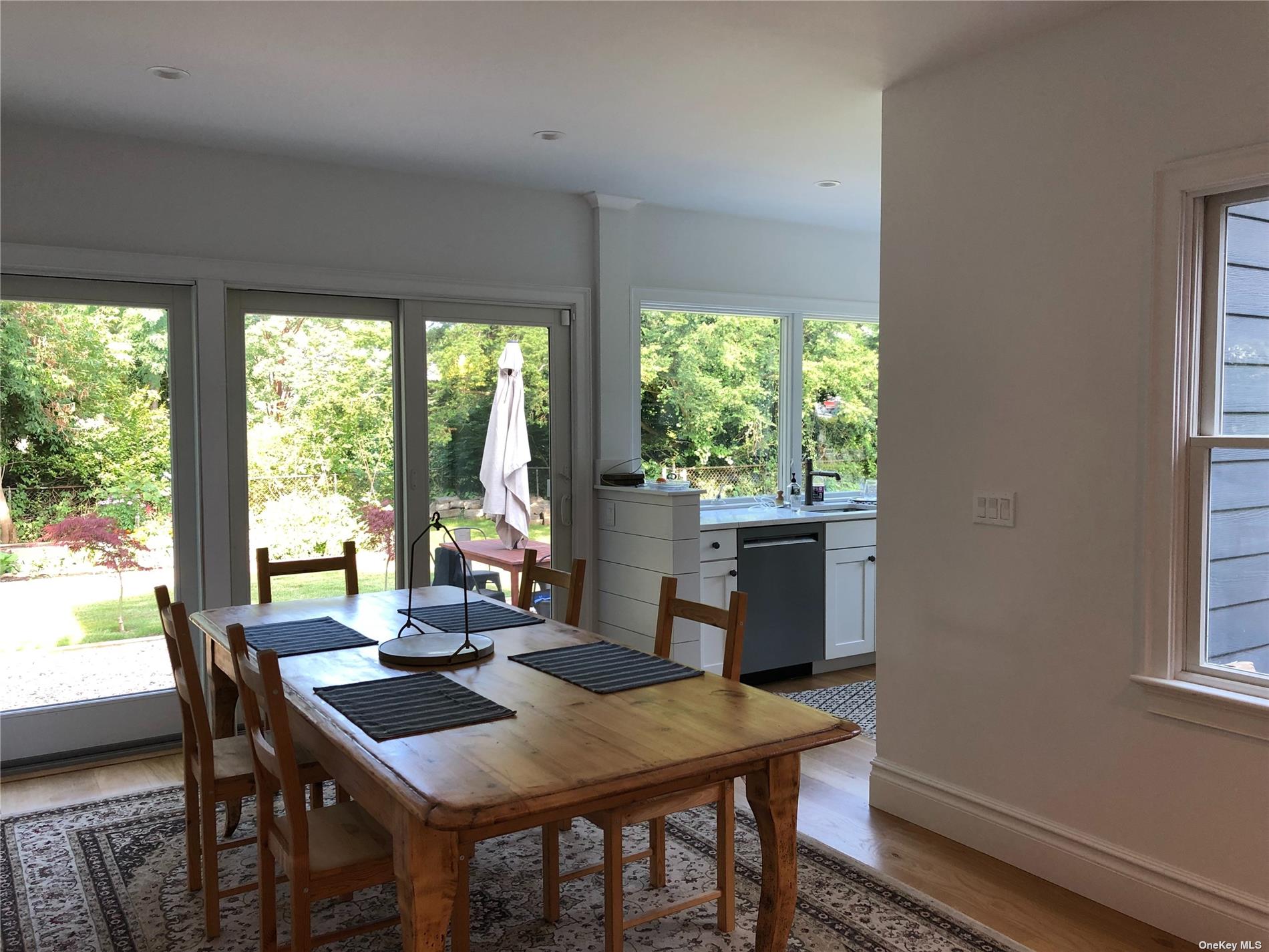 412 Greenport, undefined 00000 - Photo 4 of 18 a view of a dining room with furniture window and outside view