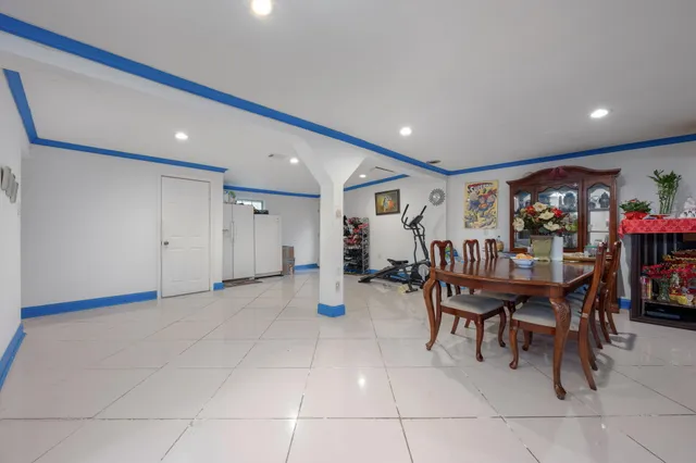 a living room with lots of furniture and a chandelier
