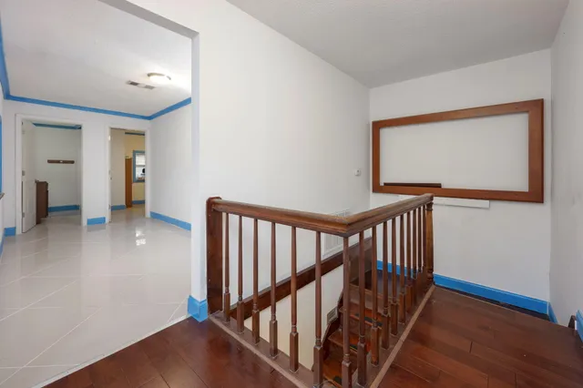 a view of an entryway with wooden floor