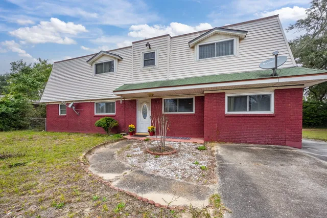 a front view of a house with yard