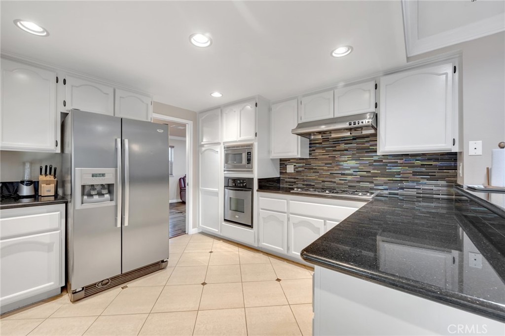 2611 Rudy Street Rowland Heights, CA 91748 - Photo 16 of 37 a kitchen with stainless steel appliances granite countertop a refrigerator and a sink