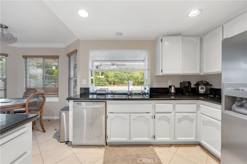2611 Rudy Street Rowland Heights, CA 91748 - Photo 17 of 37 a kitchen with stainless steel appliances granite countertop a stove a sink and white cabinets