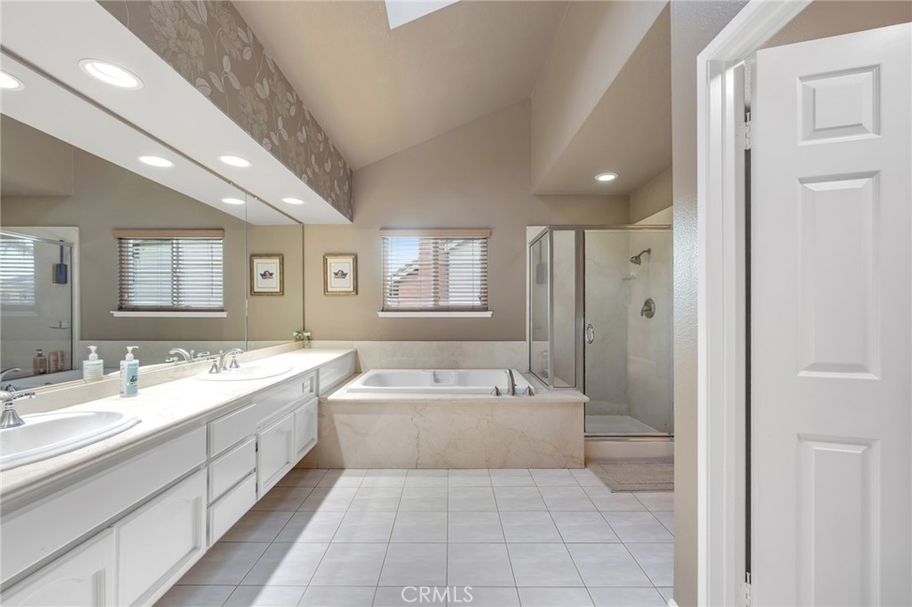 2611 Rudy Street Rowland Heights, CA 91748 - Photo 23 of 37 a bathroom with a tub double vanity sink and mirror