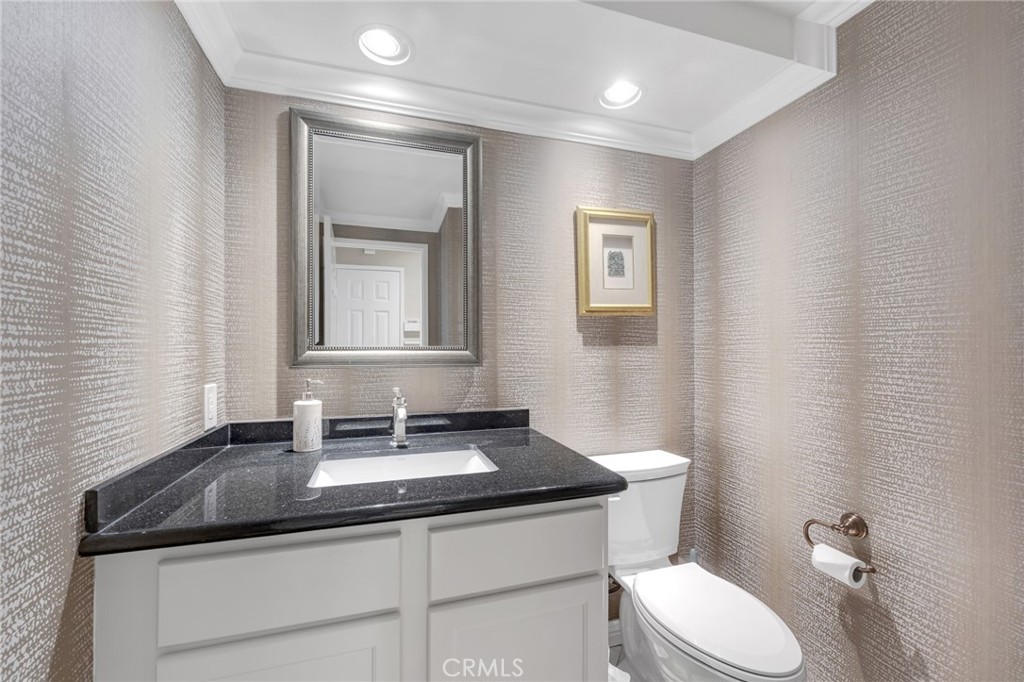 2611 Rudy Street Rowland Heights, CA 91748 - Photo 27 of 37 a bathroom with a granite countertop sink and a mirror with toilet