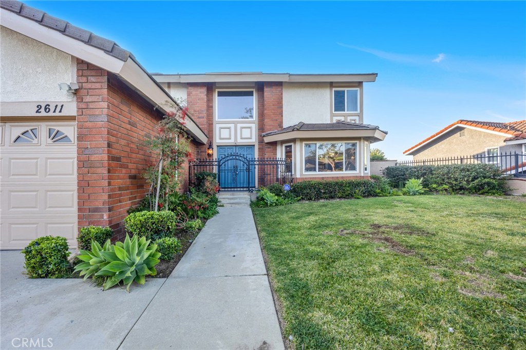 2611 Rudy Street Rowland Heights, CA 91748 - Photo 5 of 37 a front view of a house with garden
