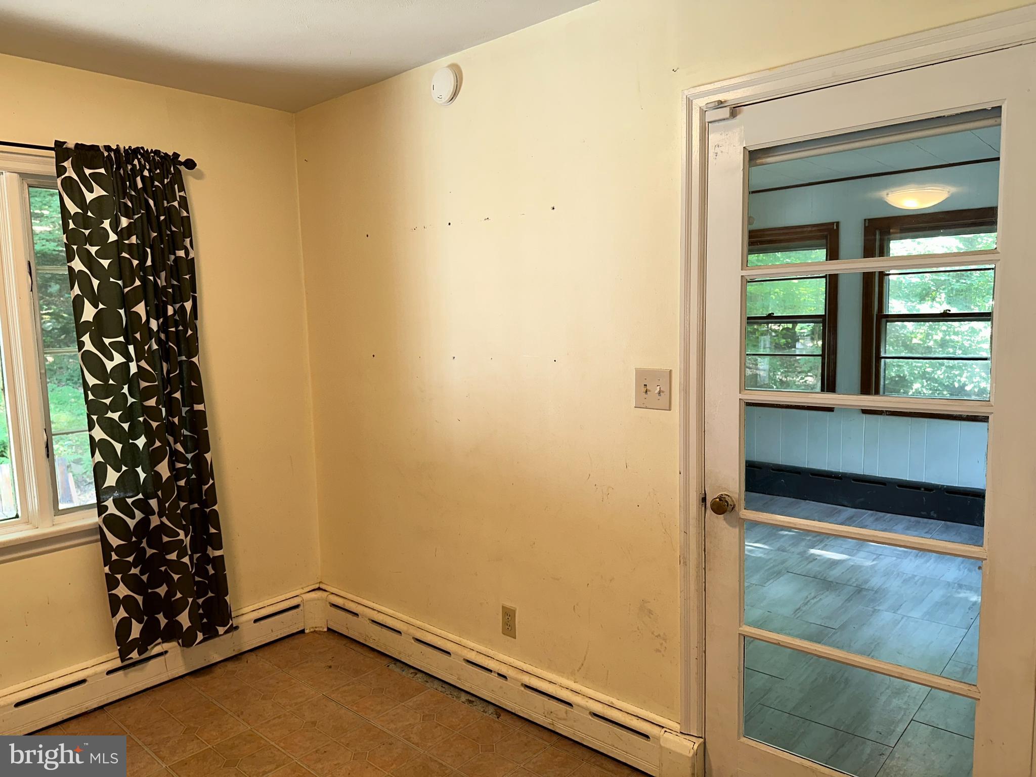 561 State Road Princeton, NJ 08540 - Photo 9 of 22 Sunroom through glass door