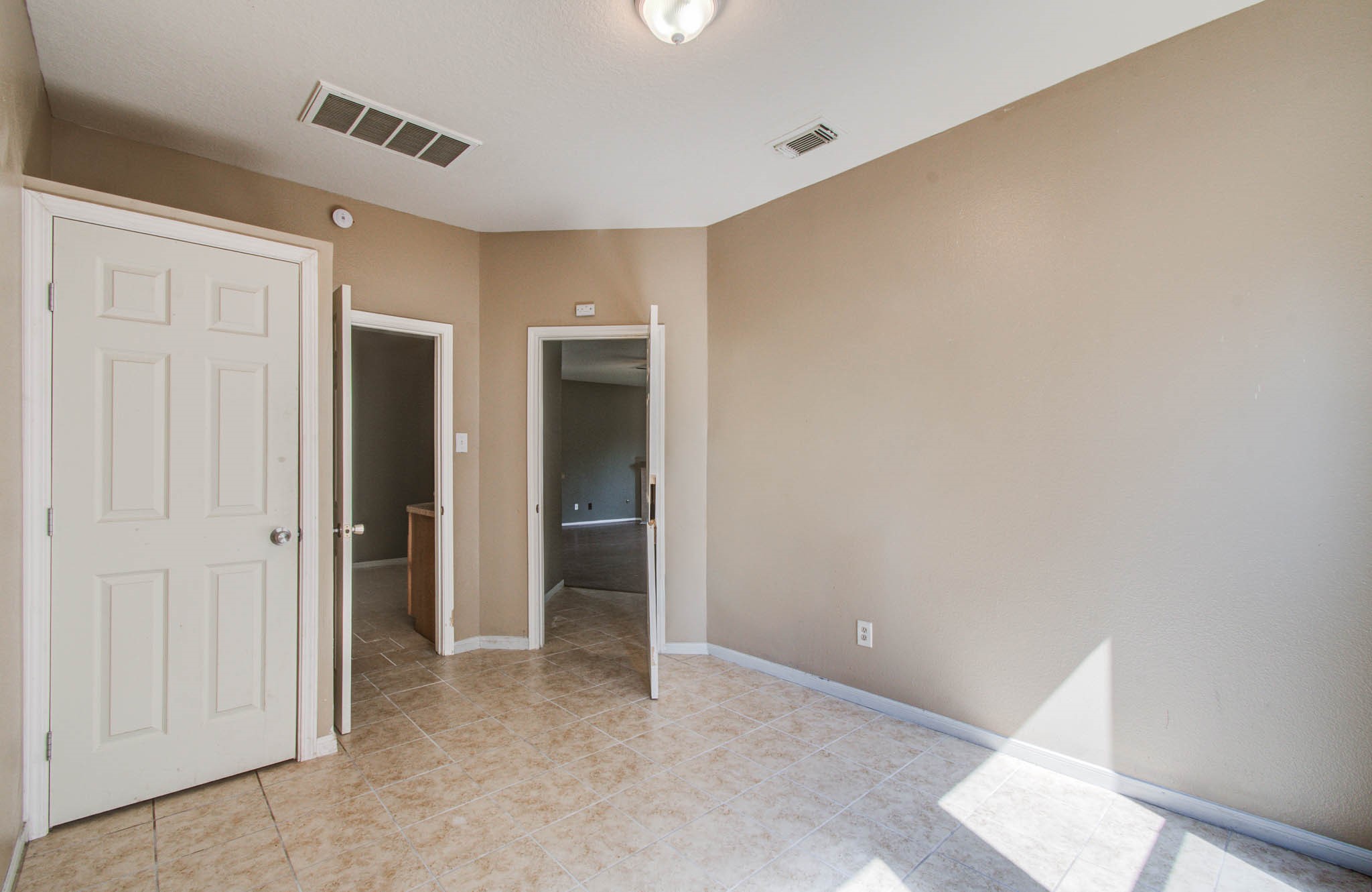 18518 Alemarble Oak Street Cypress, TX 77429 - Photo 7 of 17 an empty room with closet and a window