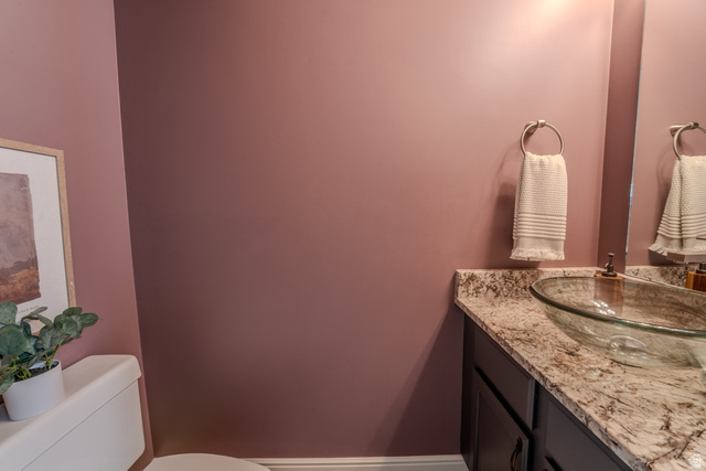 11957 Noelle Road Sandy, UT 84092 - Photo 27 of 38 Vanity with a granite countertop, glass vessel sink, and mounted faucet