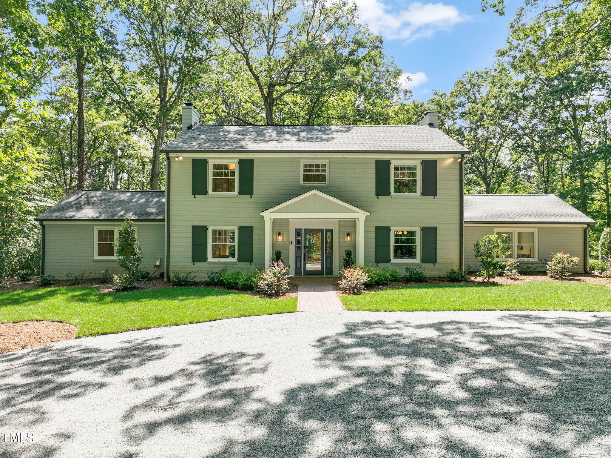 4604 Timberly Drive Durham, NC 27707 - Photo 1 of 60 a front view of a house with a yard and garage