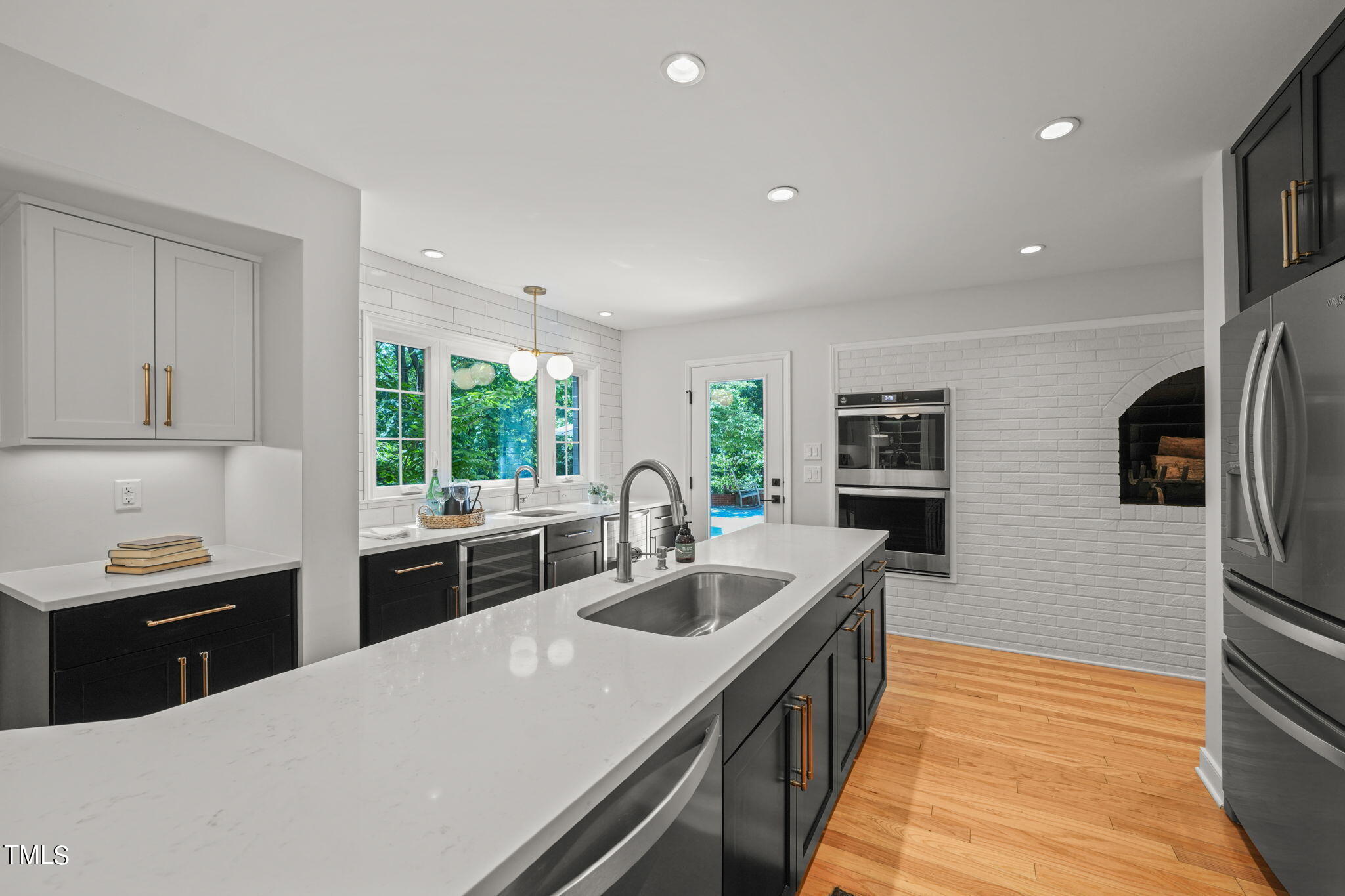 4604 Timberly Drive Durham, NC 27707 - Photo 12 of 60 a kitchen with stainless steel appliances a sink stove and refrigerator