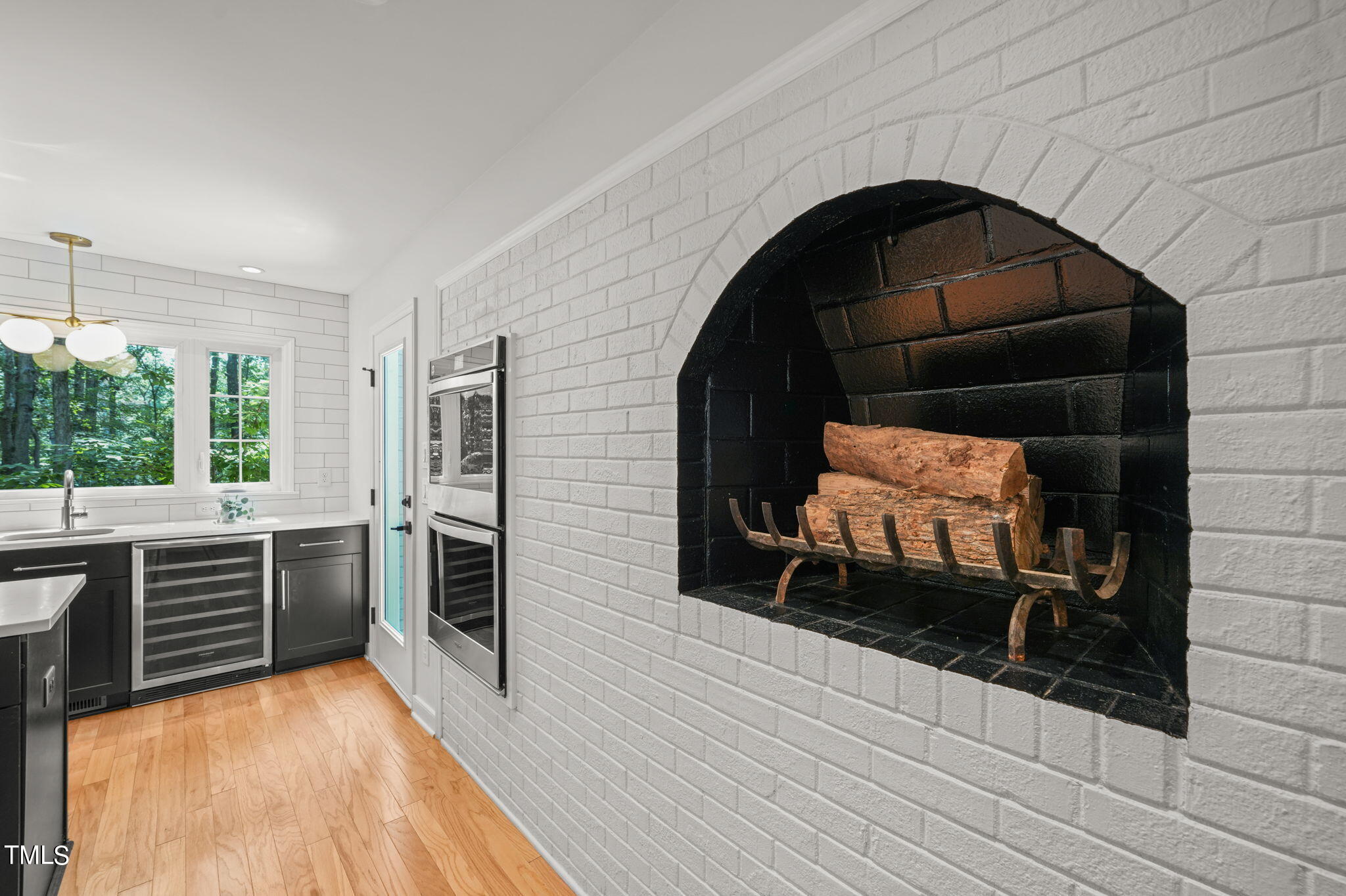 4604 Timberly Drive Durham, NC 27707 - Photo 15 of 60 a kitchen with stainless steel appliances a stove a sink and a microwave