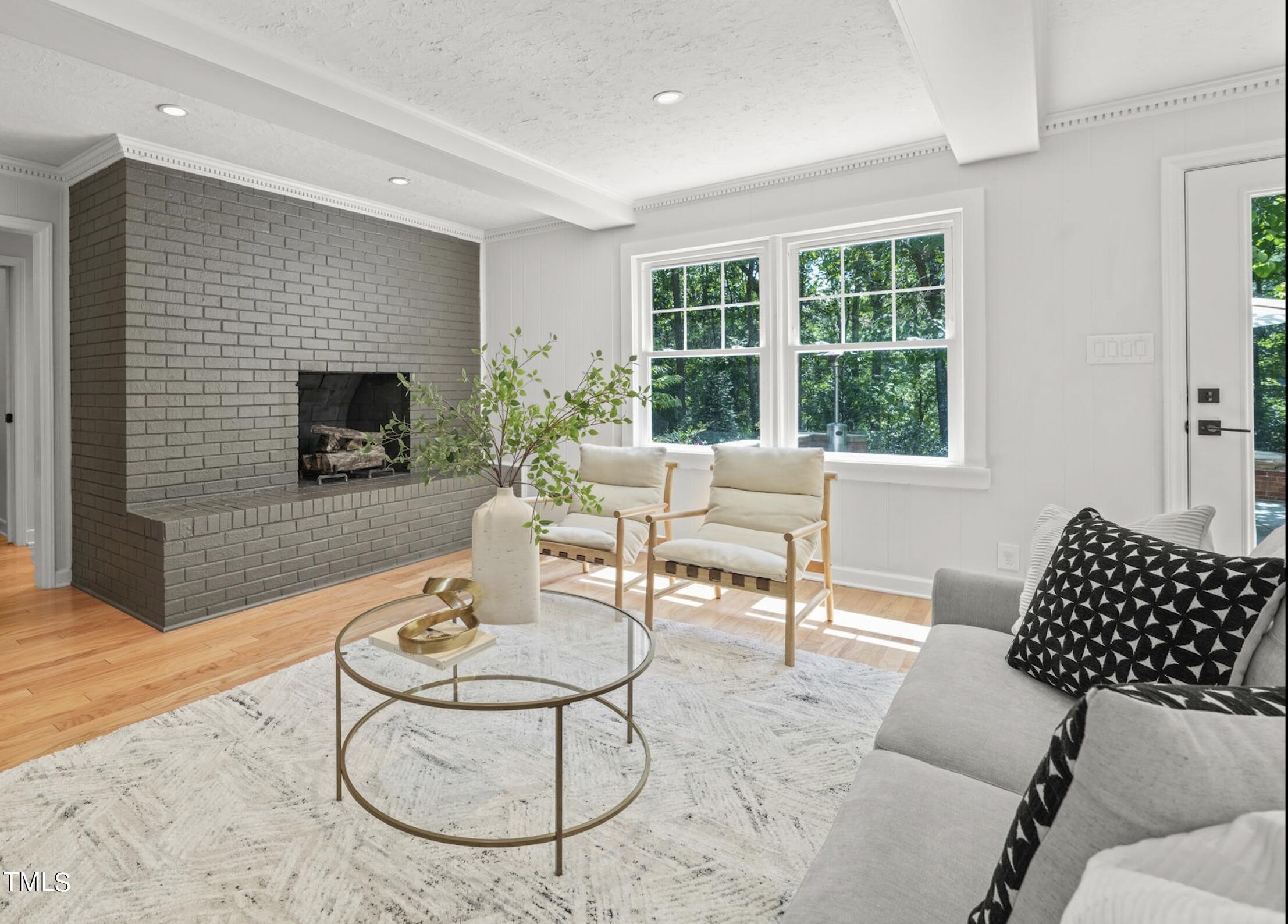 4604 Timberly Drive Durham, NC 27707 - Photo 17 of 60 a living room with furniture and a fireplace