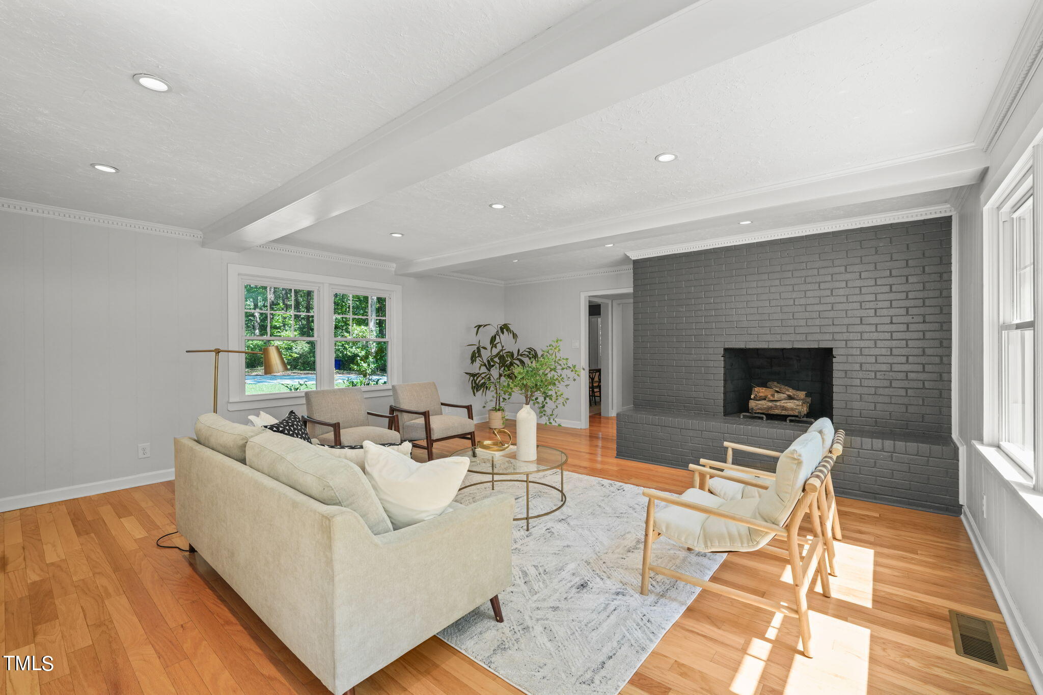 4604 Timberly Drive Durham, NC 27707 - Photo 19 of 60 a living room with furniture and a fireplace
