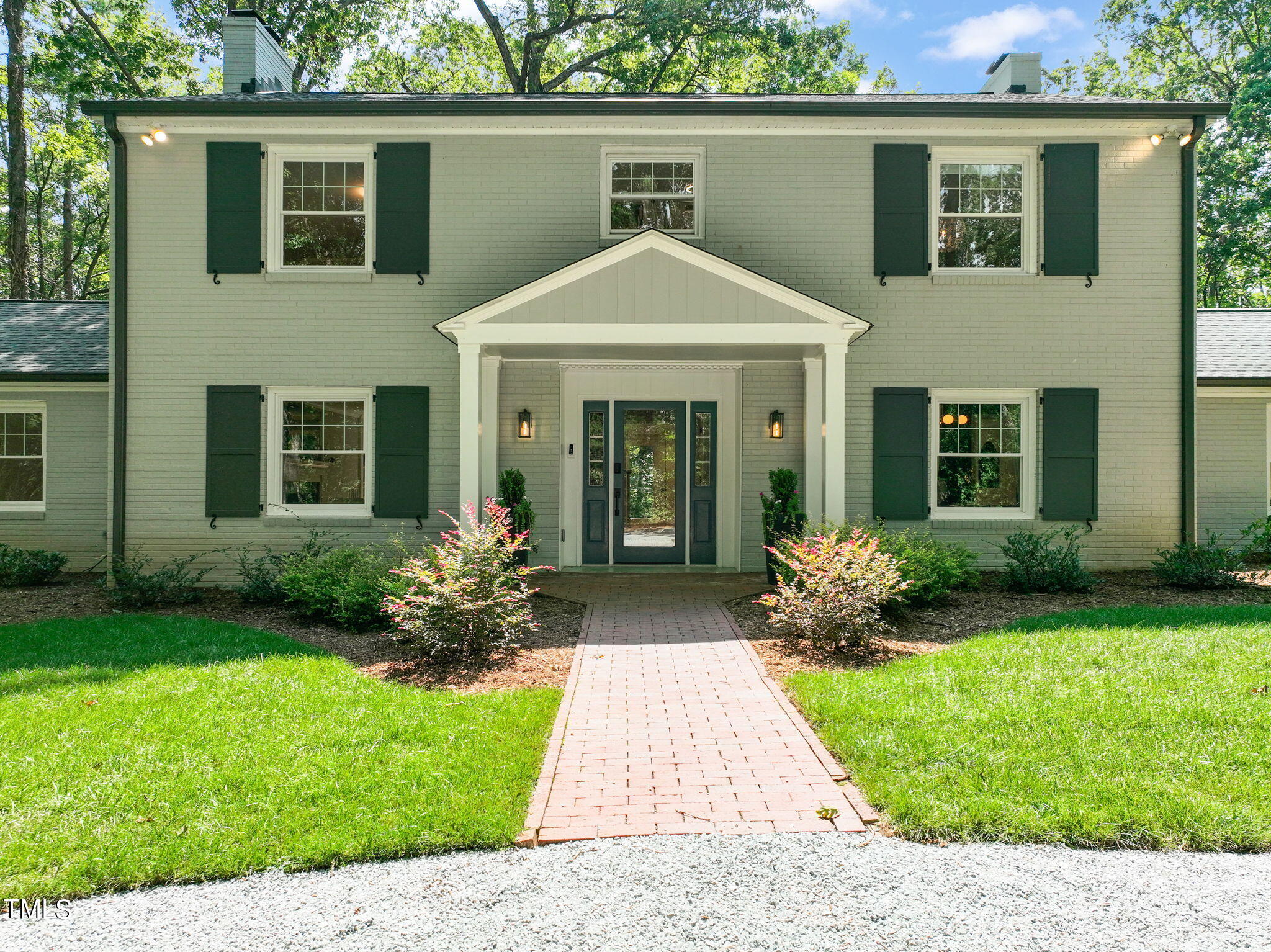 4604 Timberly Drive Durham, NC 27707 - Photo 2 of 60 a front view of a house with garden