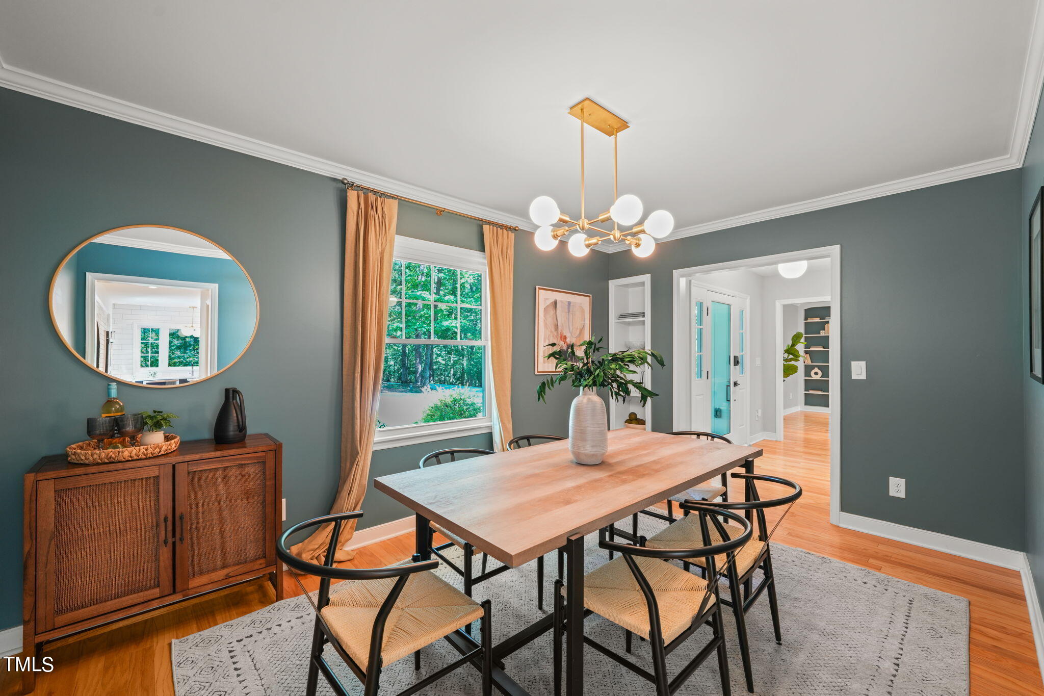 4604 Timberly Drive Durham, NC 27707 - Photo 21 of 60 a view of a dining room with furniture and a chandelier