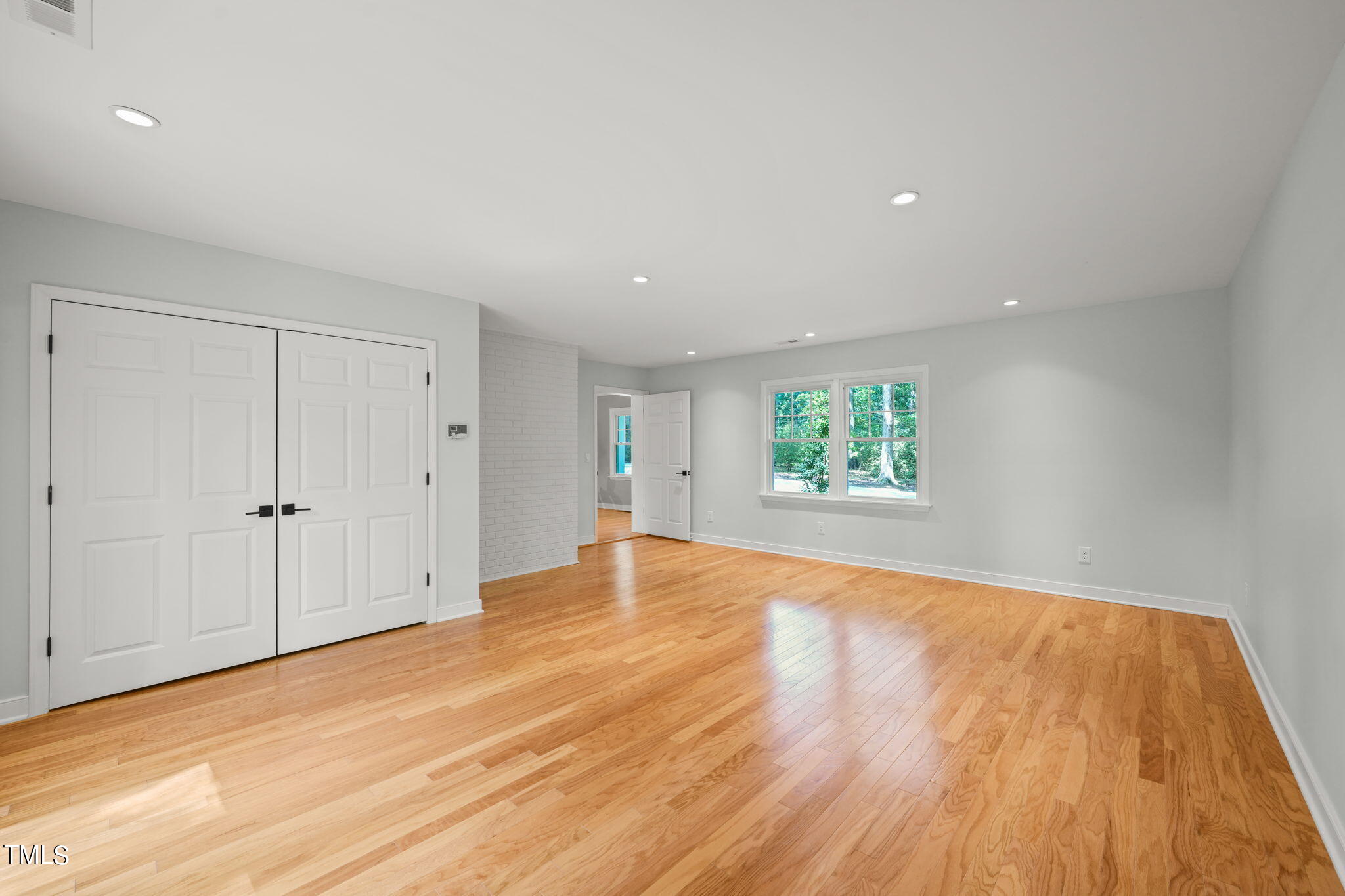 4604 Timberly Drive Durham, NC 27707 - Photo 23 of 60 a view of an empty room with wooden floor and window