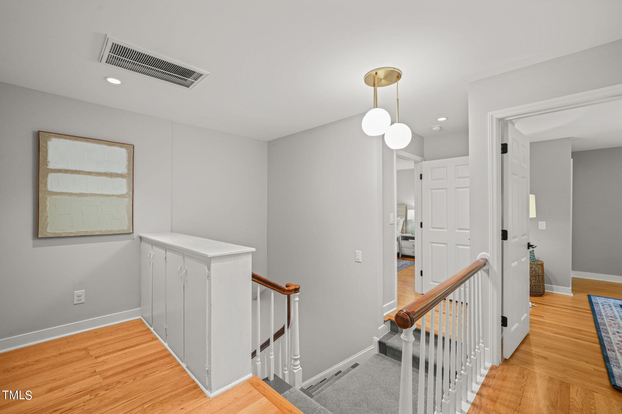 4604 Timberly Drive Durham, NC 27707 - Photo 25 of 60 a view of a hallway with a chandelier