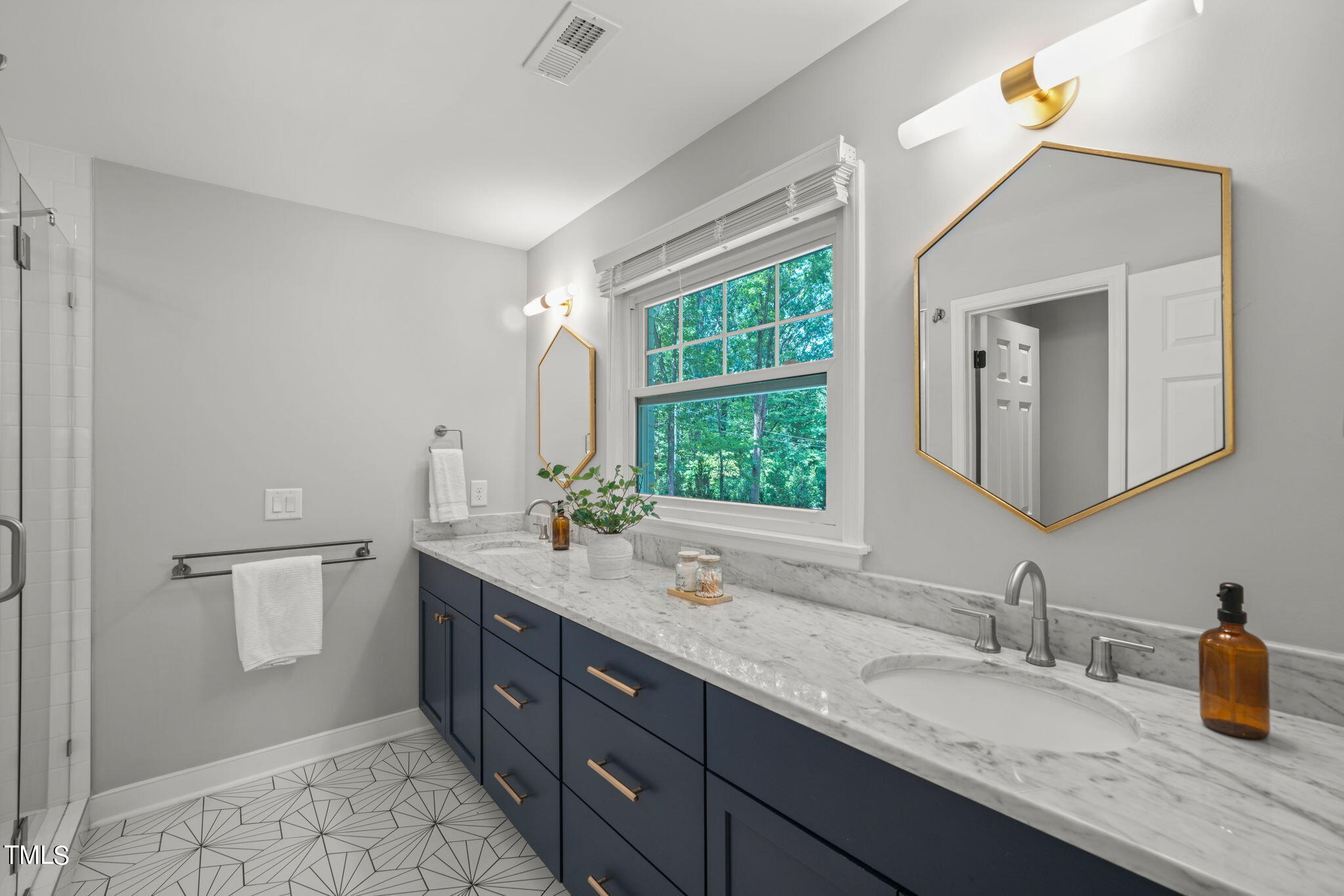 4604 Timberly Drive Durham, NC 27707 - Photo 28 of 60 a bathroom with a granite countertop sink and a mirror