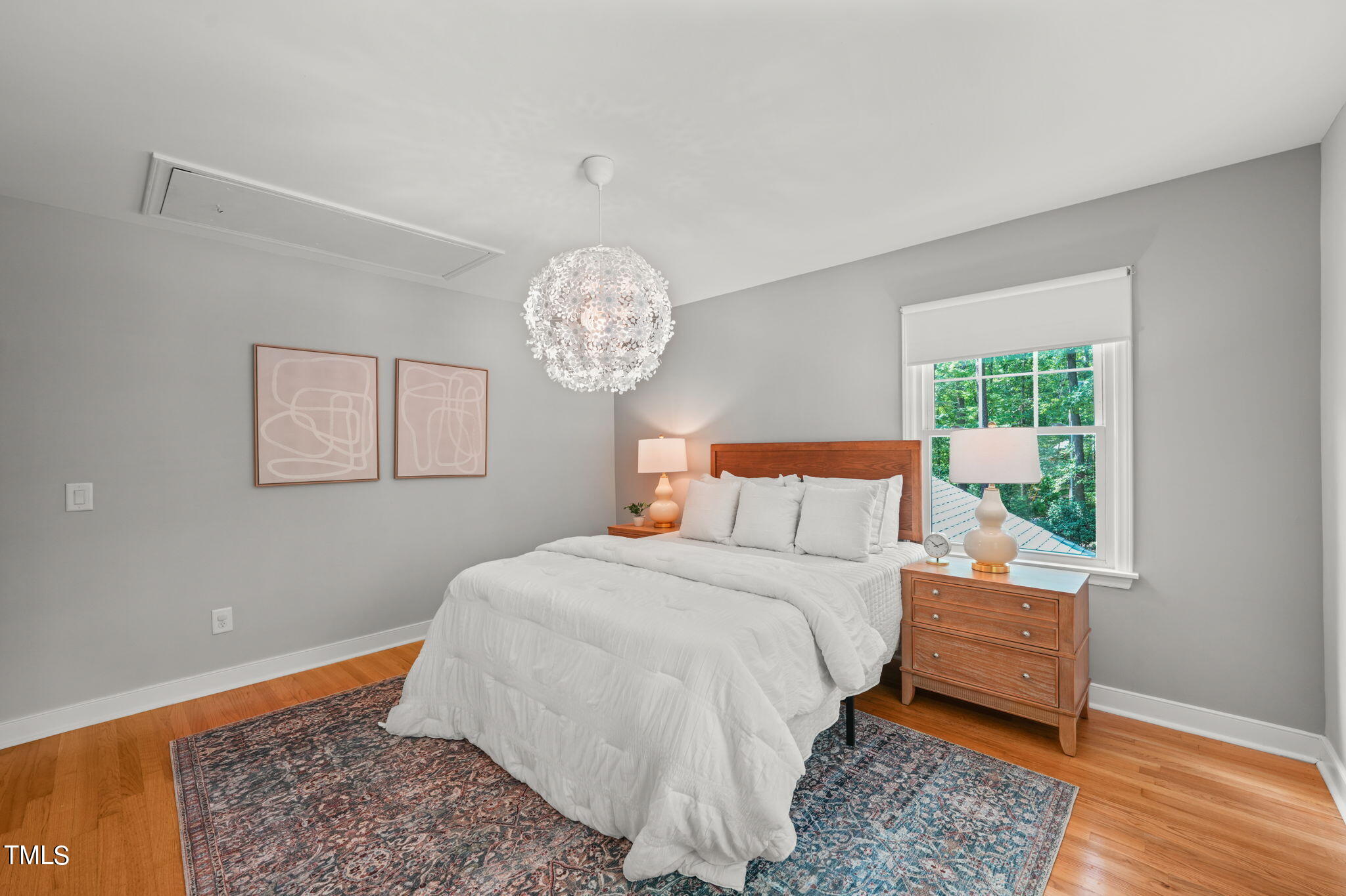 4604 Timberly Drive Durham, NC 27707 - Photo 37 of 60 a bedroom with a bed and a wooden floor