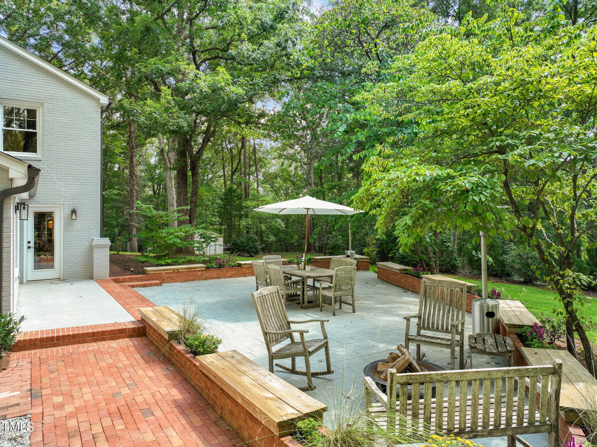 4604 Timberly Drive Durham, NC 27707 - Photo 38 of 60 a view of a patio with chairs and tables