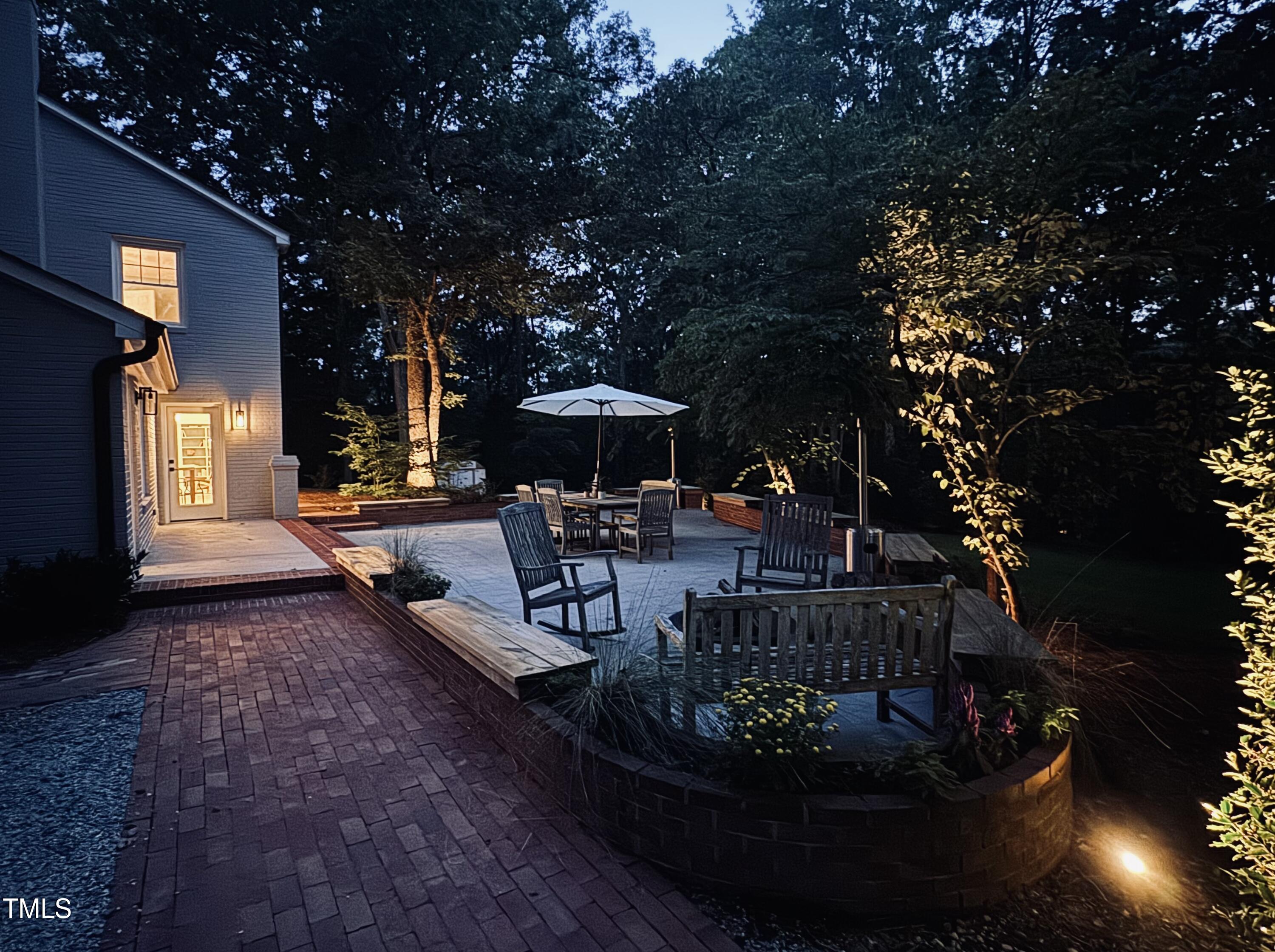 4604 Timberly Drive Durham, NC 27707 - Photo 39 of 60 a living room with patio furniture and a fountain
