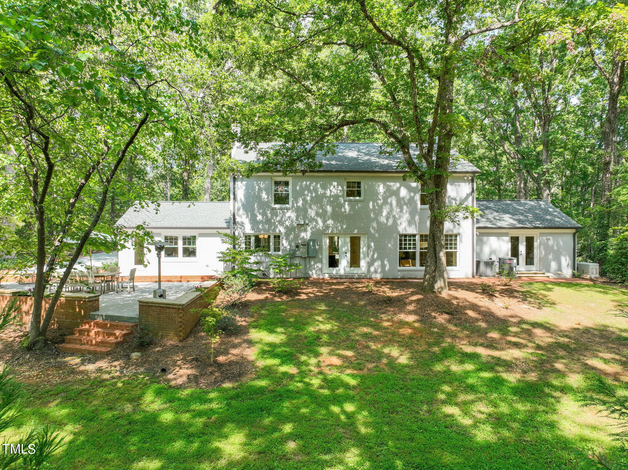 4604 Timberly Drive Durham, NC 27707 - Photo 44 of 60 a front view of a house with a garden