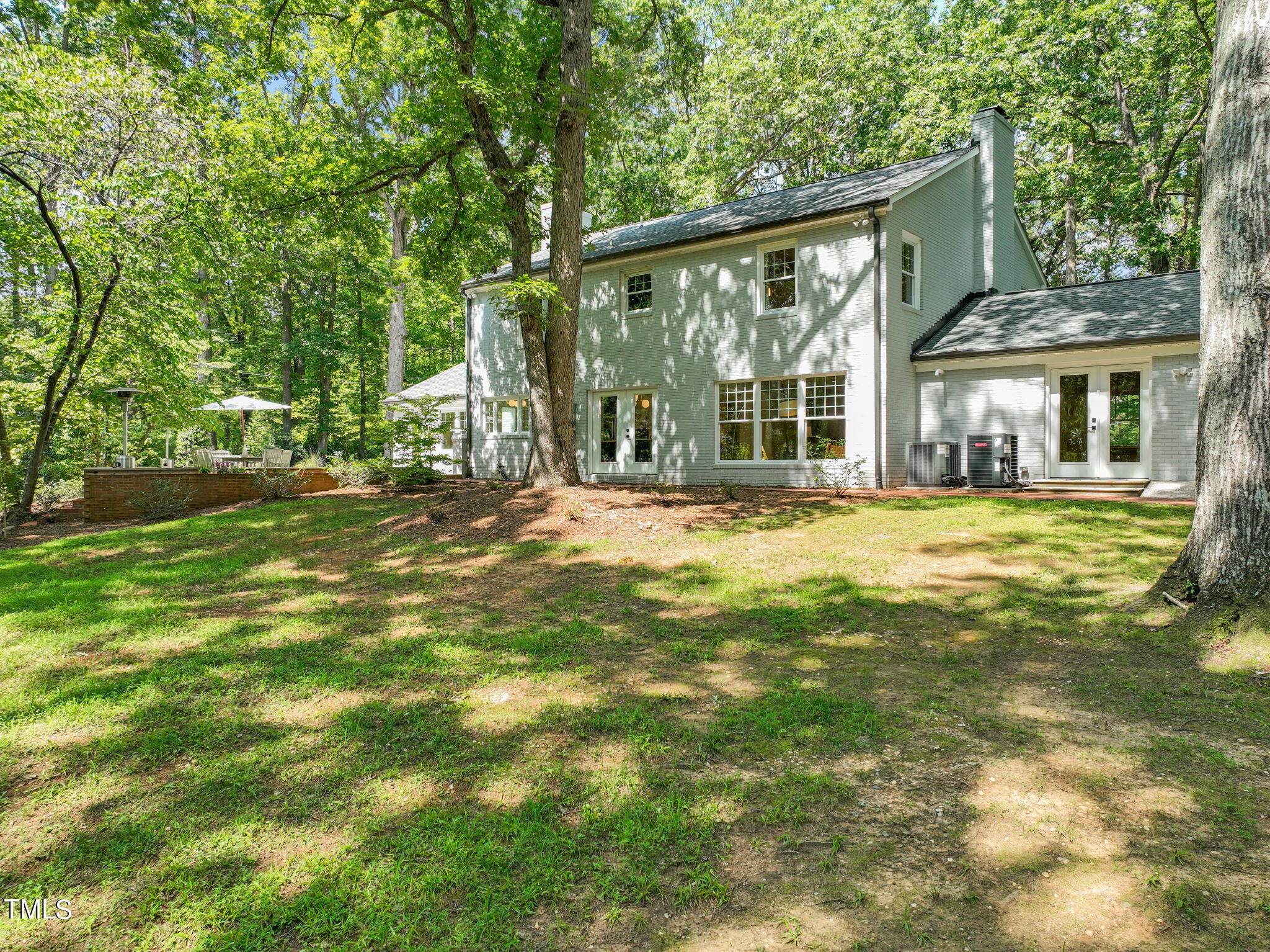 4604 Timberly Drive Durham, NC 27707 - Photo 47 of 60 a view of a house with a big yard and large trees