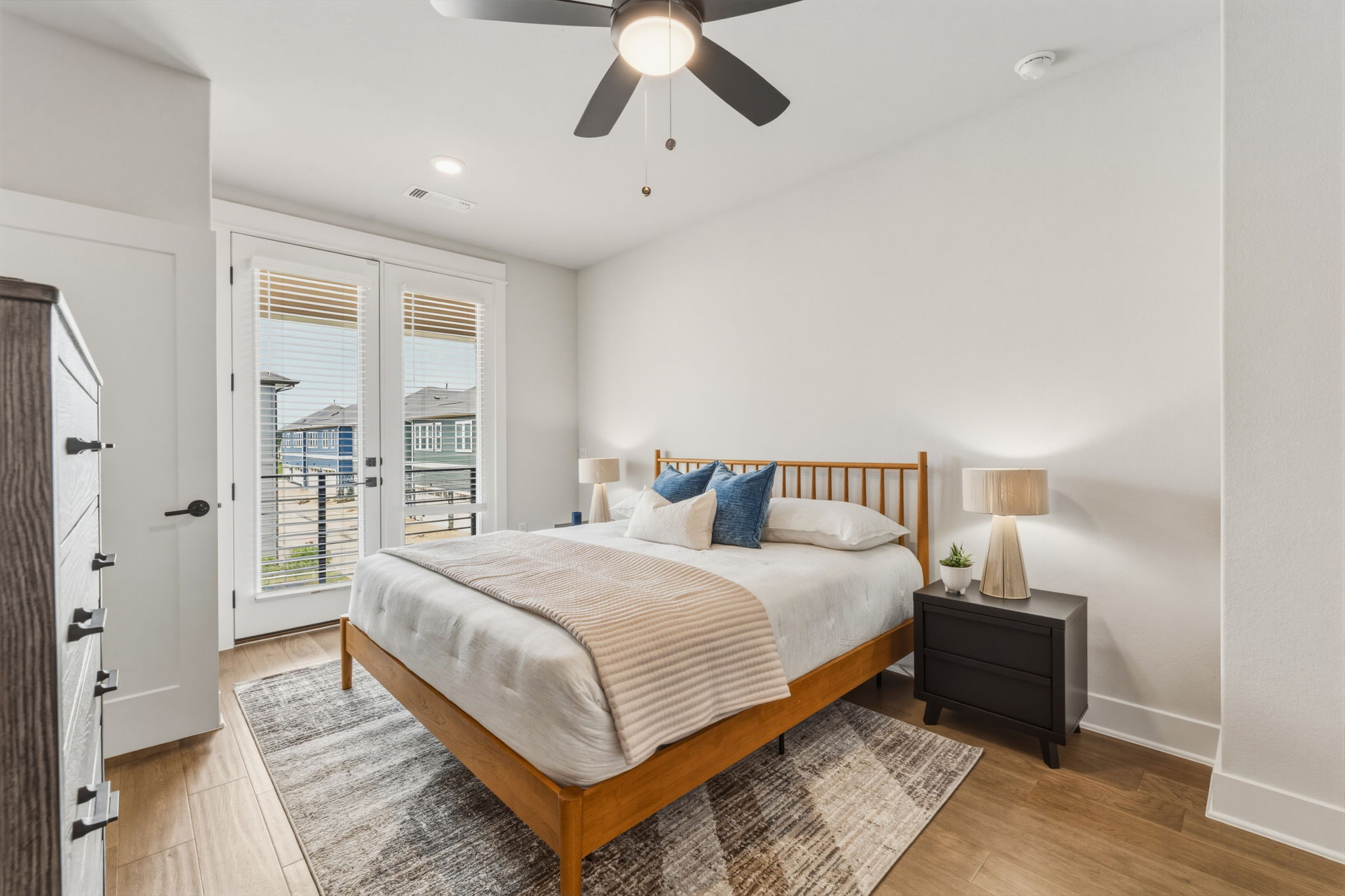 2929 Moreno Street Austin, TX 78723 - Photo 29 of 40 Bedroom featuring light wood-finish flooring and a ceiling fan