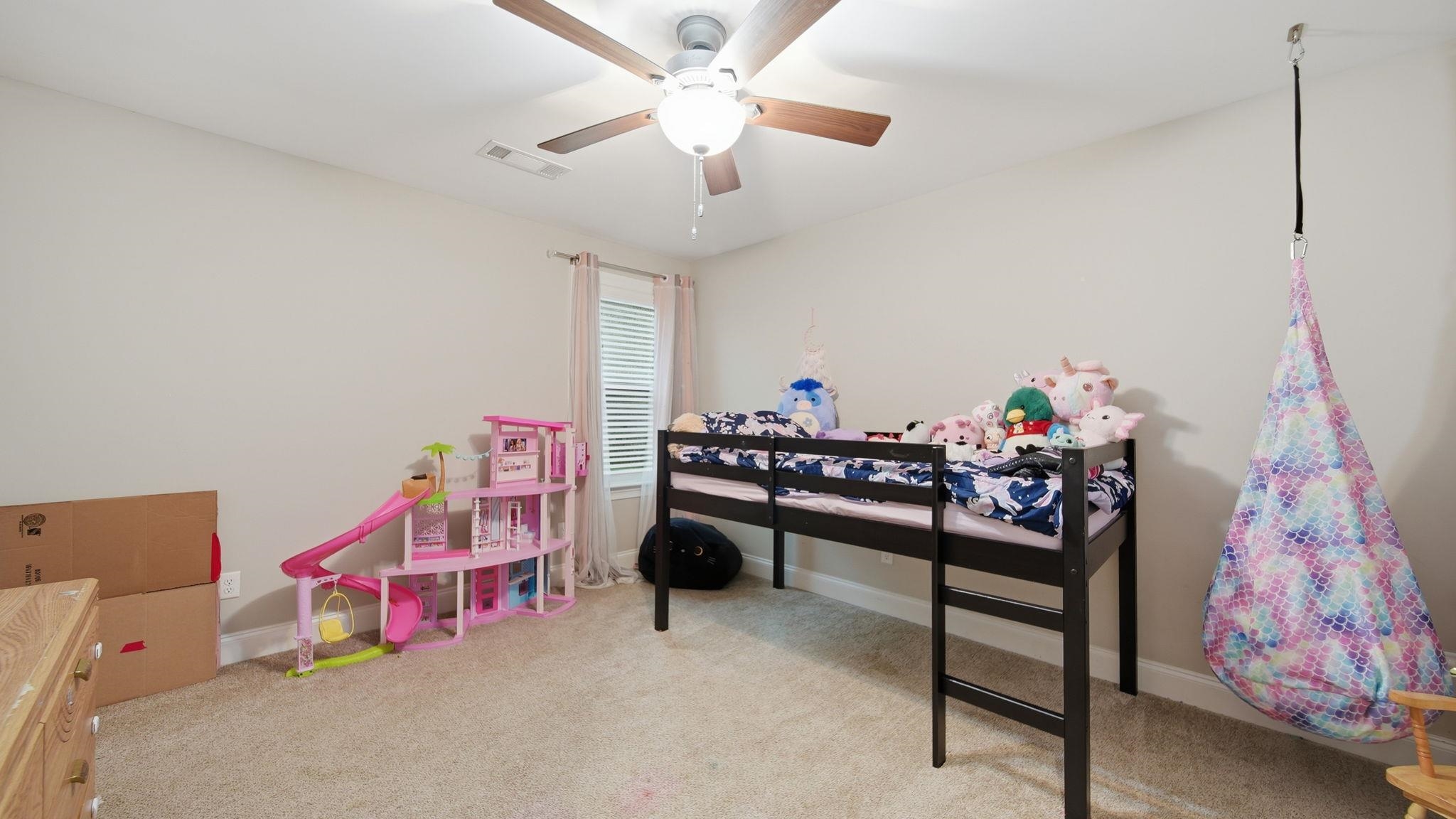 70 Trinity Cove Atoka, TN 38004 - Photo 18 of 25 Carpeted room featuring a ceiling fan with light fixture, window with blinds, and neutral wall paint