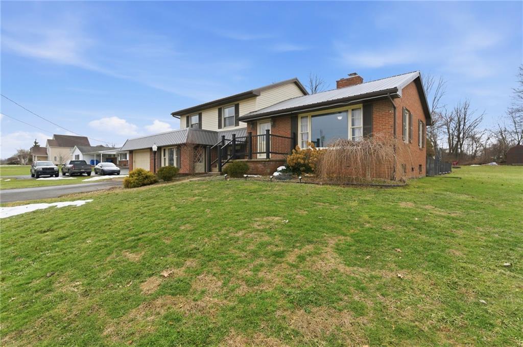 942 Cleland Mill Road New Castle, PA 16102 - Photo 2 of 41 a front view of a house with a yard