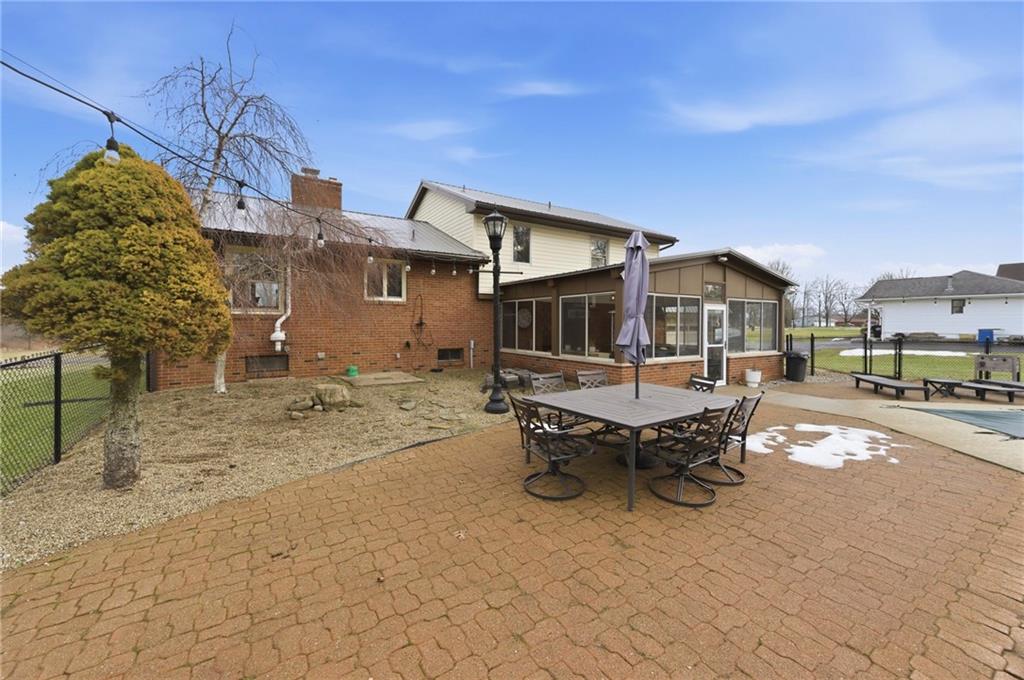 942 Cleland Mill Road New Castle, PA 16102 - Photo 30 of 41 a view of a patio with a table and chairs