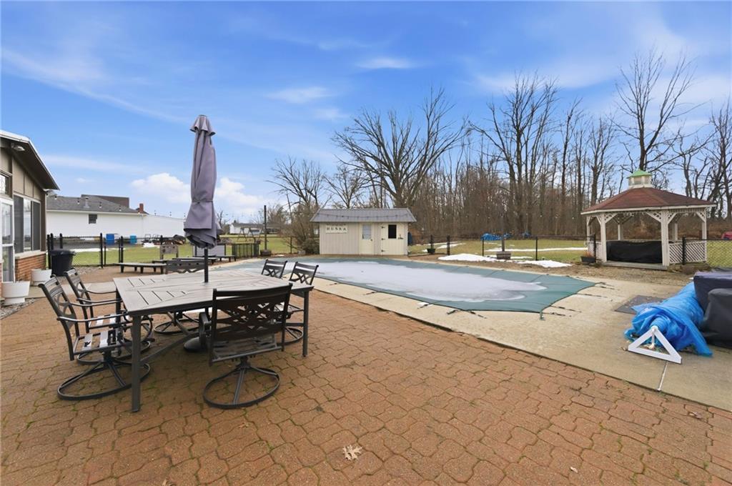 942 Cleland Mill Road New Castle, PA 16102 - Photo 33 of 41 a swimming pool with outdoor seating and city view