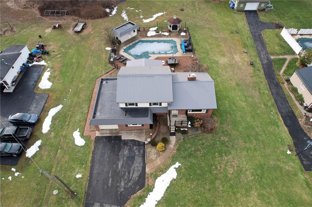 942 Cleland Mill Road New Castle, PA 16102 - Photo 38 of 41 an aerial view of a house with a swimming pool