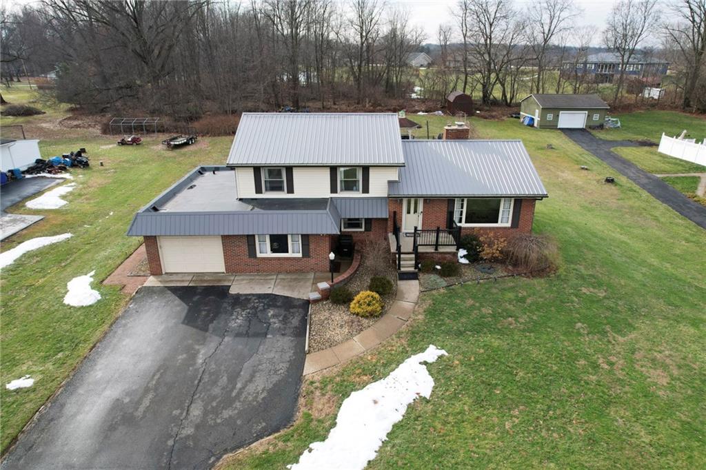 942 Cleland Mill Road New Castle, PA 16102 - Photo 40 of 41 an aerial view of a house with swimming pool