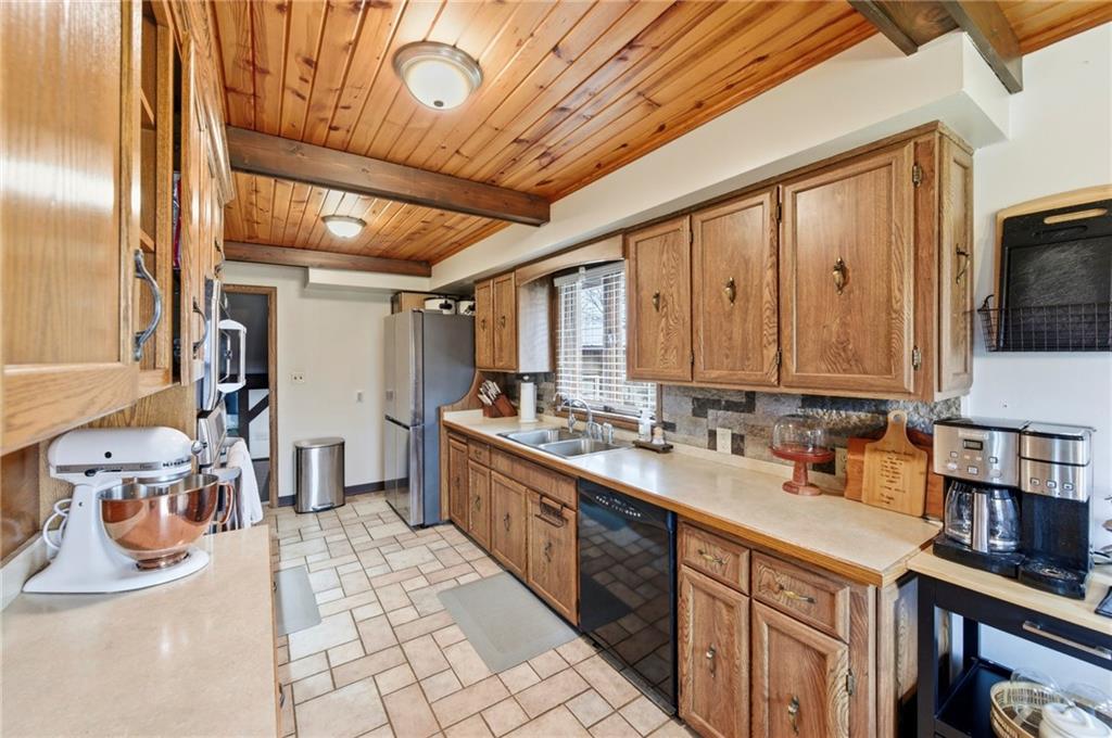 942 Cleland Mill Road New Castle, PA 16102 - Photo 9 of 41 a kitchen with stainless steel appliances granite countertop a sink and cabinets