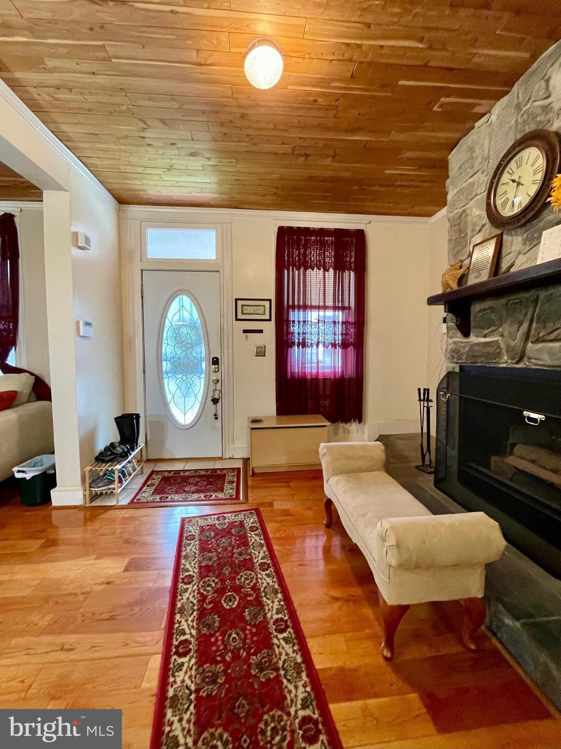 4428 Raspe Avenue Baltimore, MD 21206 - Photo 11 of 44 Large living room with wood floors and fireplace
