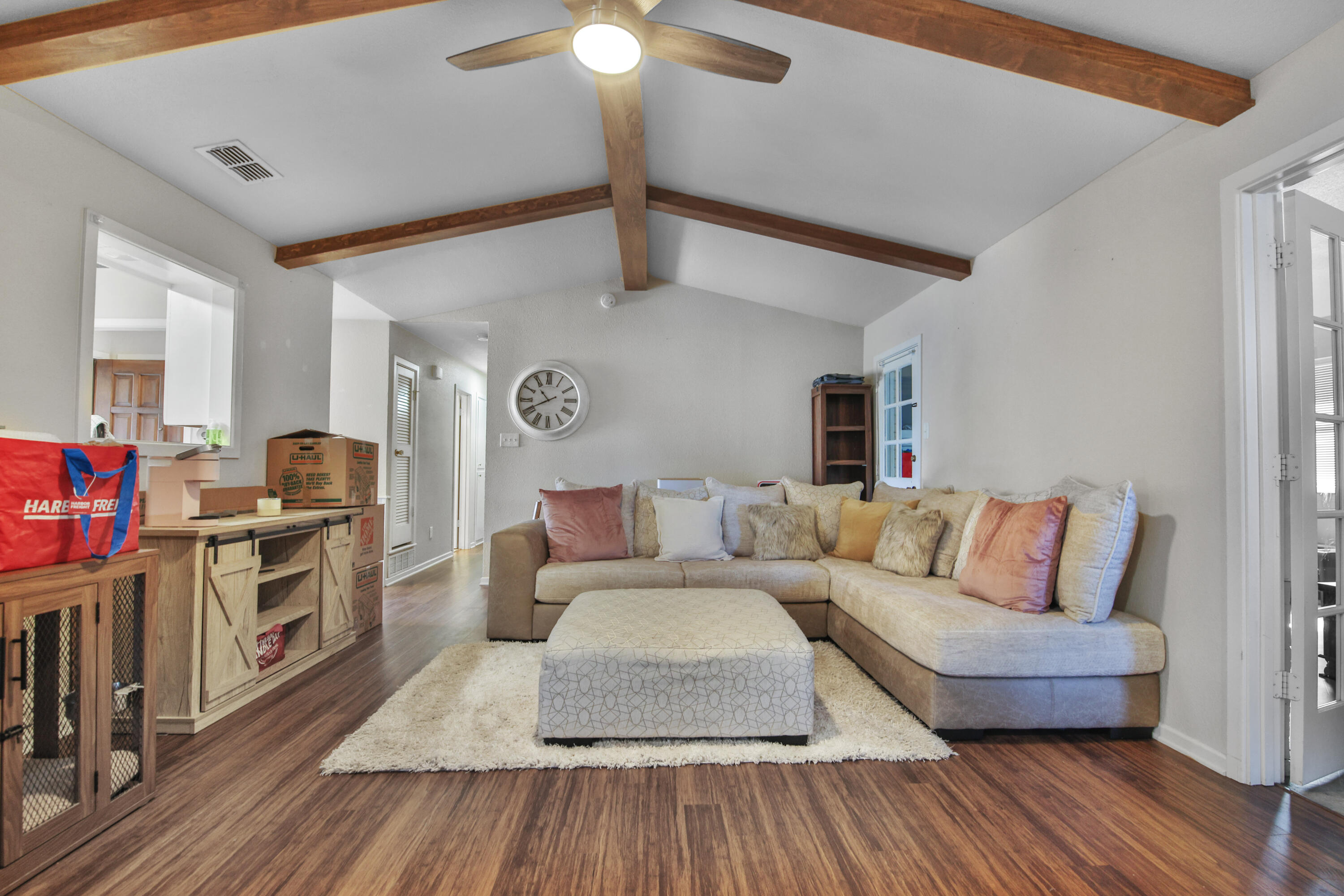 5625 Amherst Street Lubbock, TX 79416 - Photo 11 of 32 a living room with furniture and a wooden floor