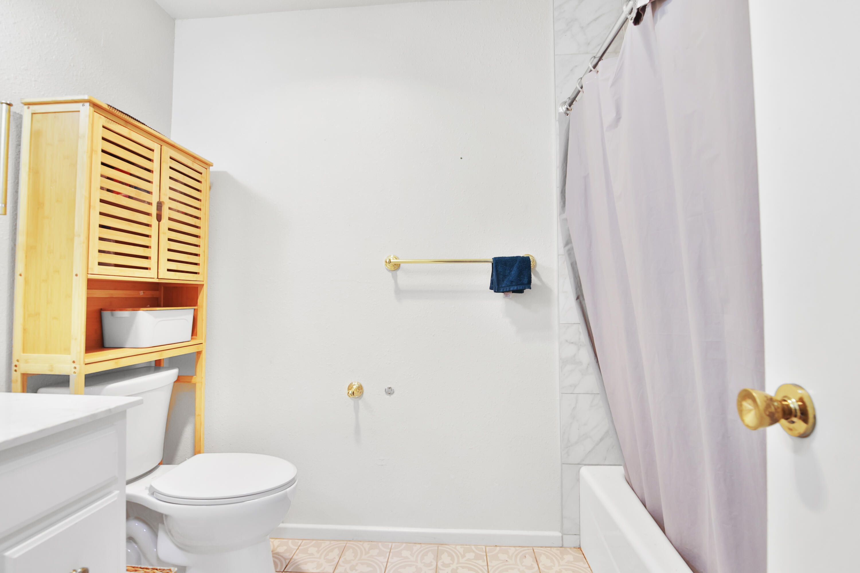 5625 Amherst Street Lubbock, TX 79416 - Photo 13 of 32 a bathroom with a sink and a toilet