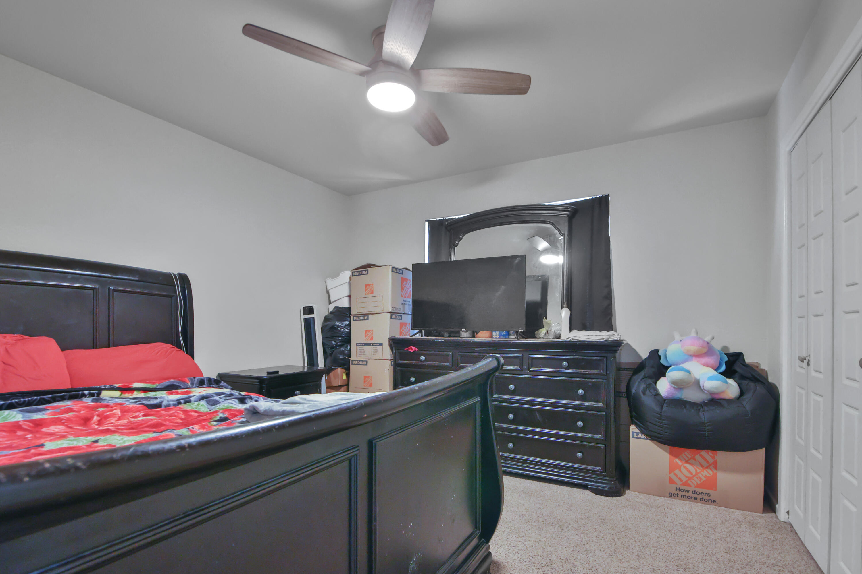 5625 Amherst Street Lubbock, TX 79416 - Photo 23 of 32 a bedroom with a bed and a television