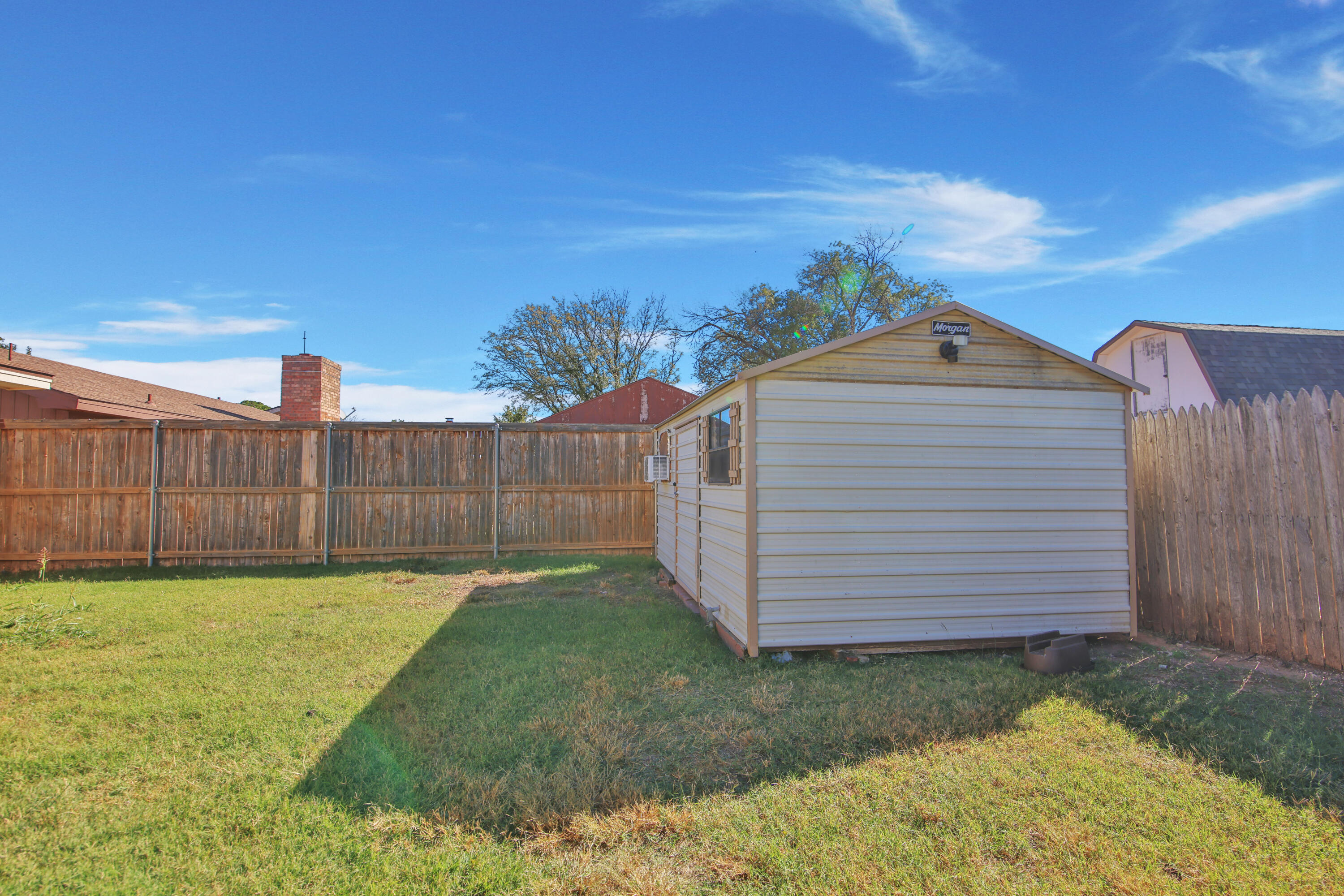 5625 Amherst Street Lubbock, TX 79416 - Photo 31 of 32 a view of a backyard with a garden