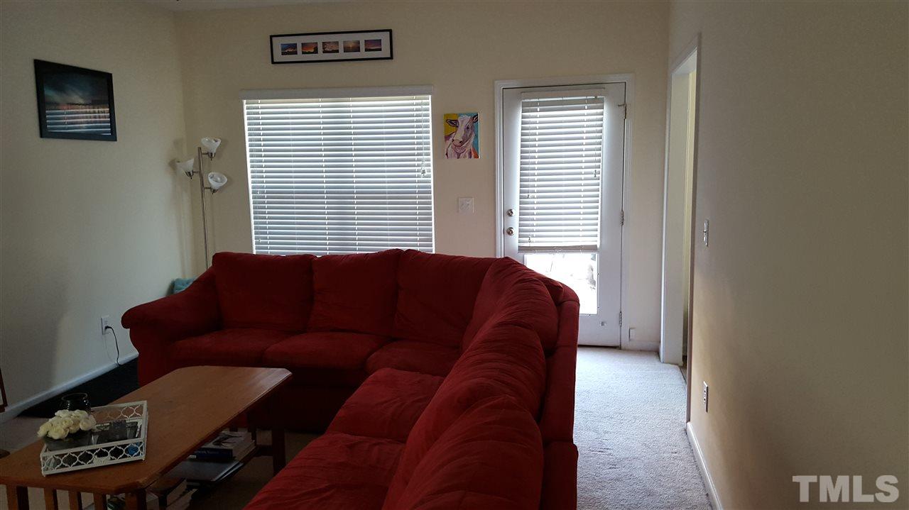 4806 Kitledge Drive Raleigh, NC 27610 - Photo 6 of 24 a living room with furniture and a window
